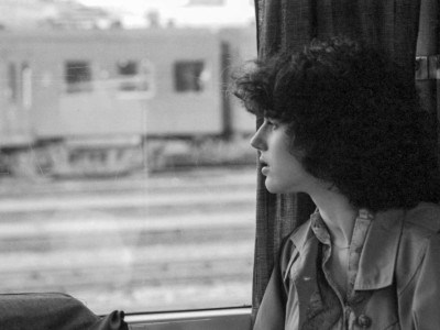 Sue looking out train window, Belgium 1980